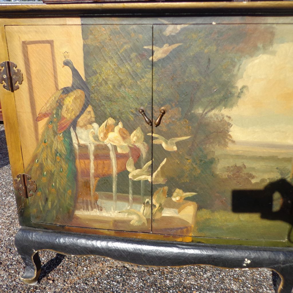 Small vintage cabinet with colorful peacock painting