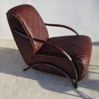 Classic quilted leather club chair with arms