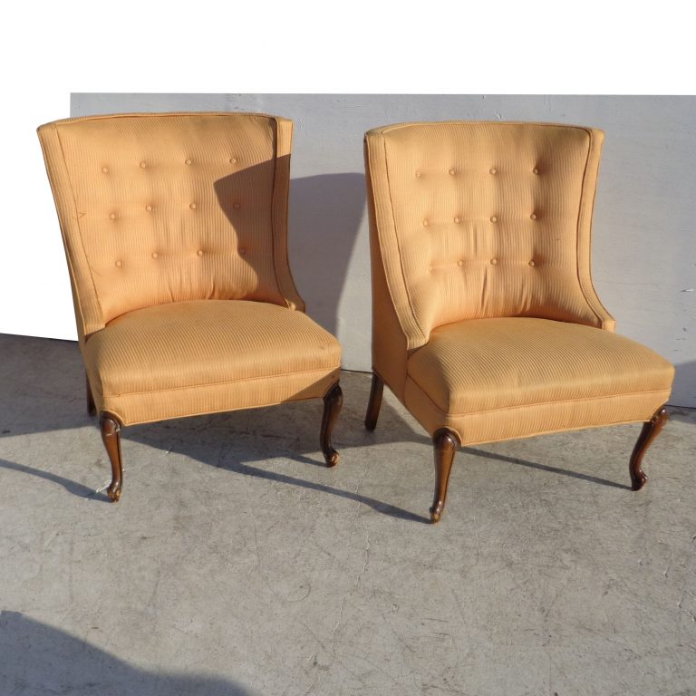 Mid-Century Modern Regency Slipper Chairs, designed with plush cushioning and classic button tufting. Ideal for creating inviting seating areas in living rooms, bedrooms, or home offices.