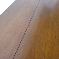 Fliptop dining table in rosewood finish
