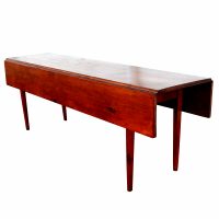 Space-saving drop leaf table in mid-century design