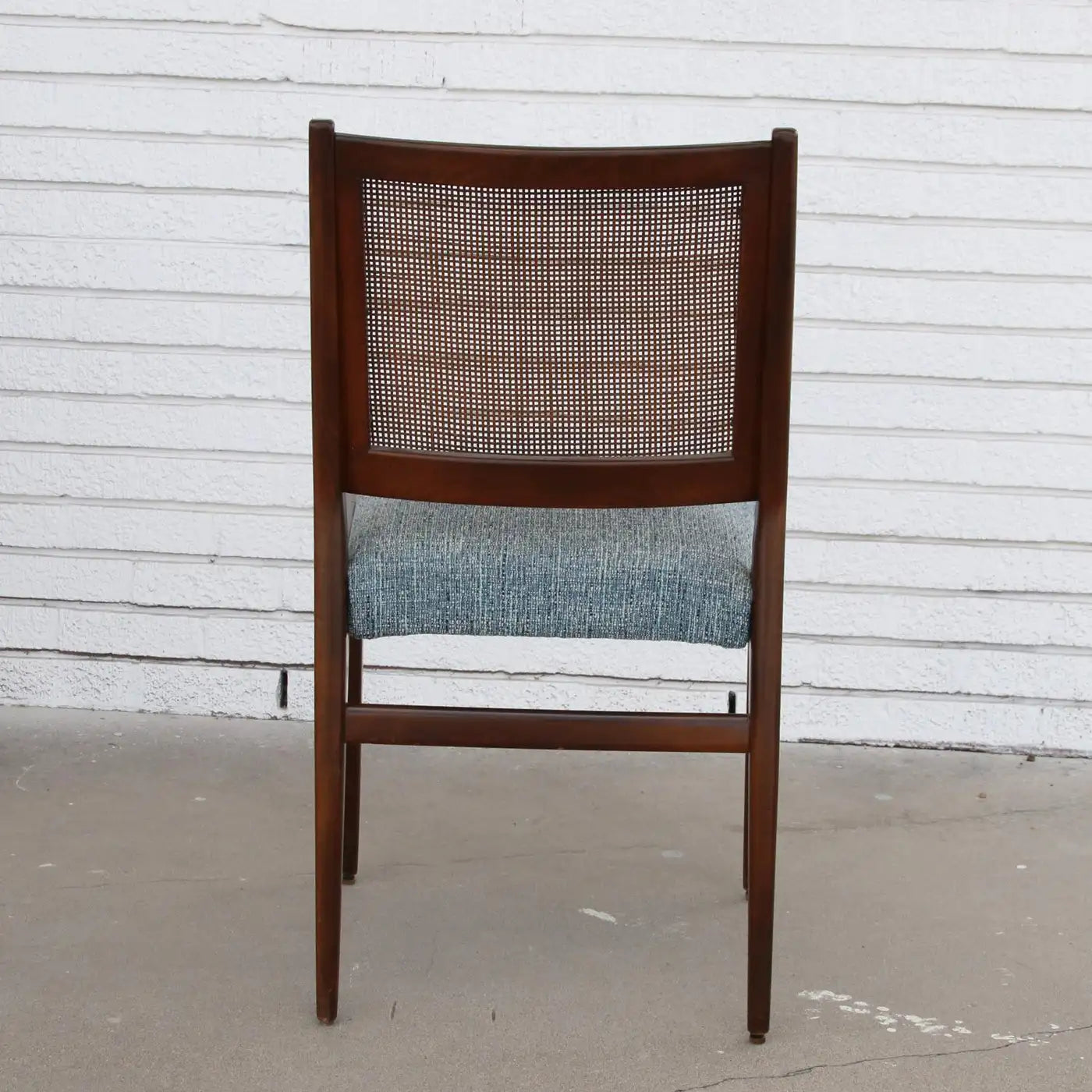 Front view of Ekselius teak dining chairs