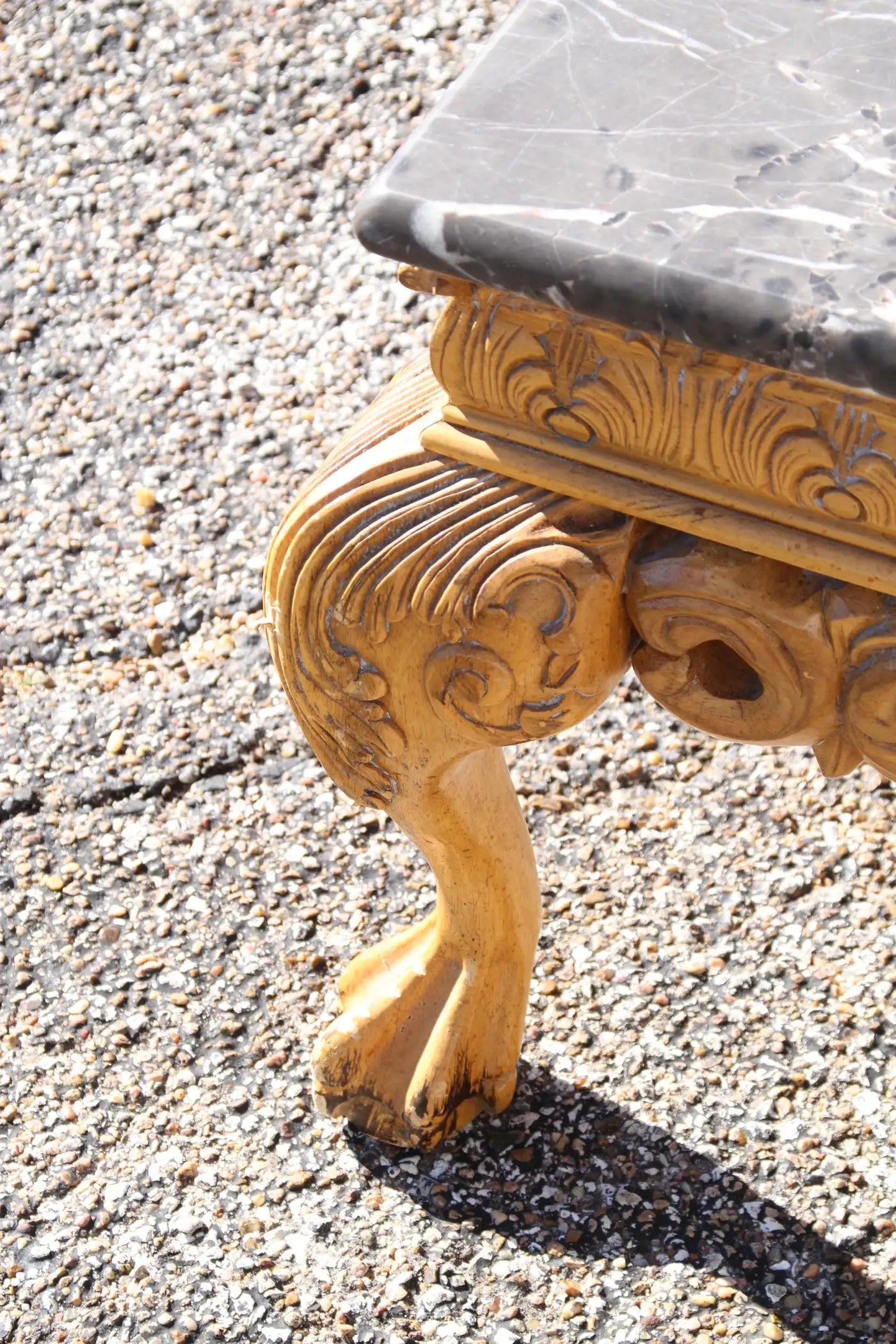 Detailed carved base marble coffee table
