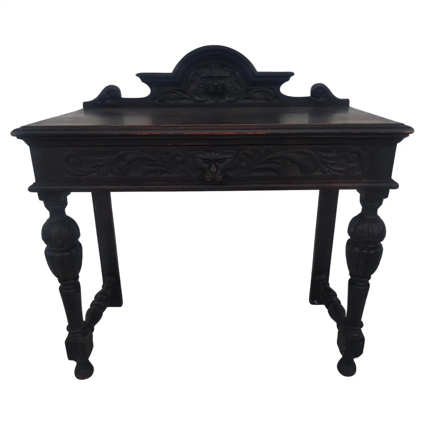 Antique wooden writing desk with carved lion faces