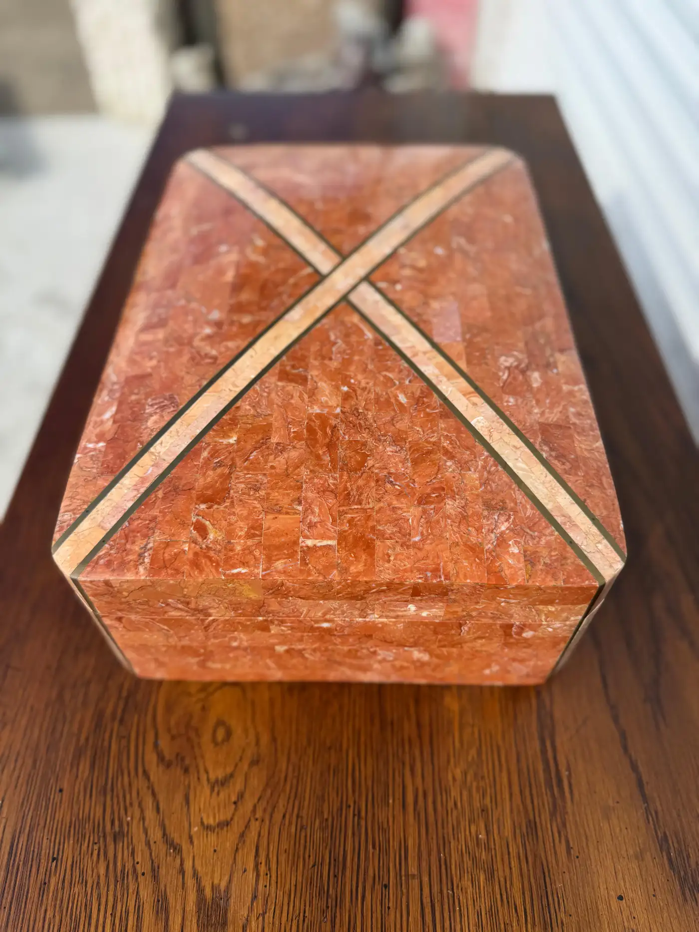Distinctive coral marble box with crisscross brass inlay, luxury collectible accent