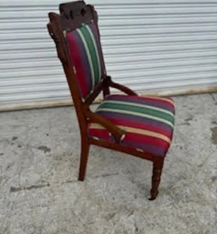 Eastlake antique chair with casters on front legs – vintage beauty.