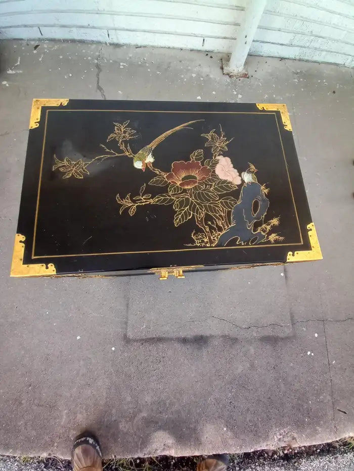 Chinoiserie style lacquered cabinet for vintage Asian interiors.