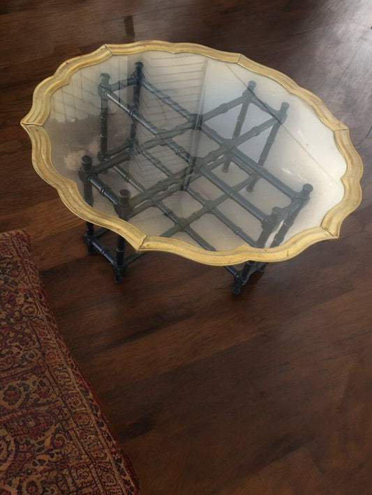 Brass banded glass top coffee table with modern design