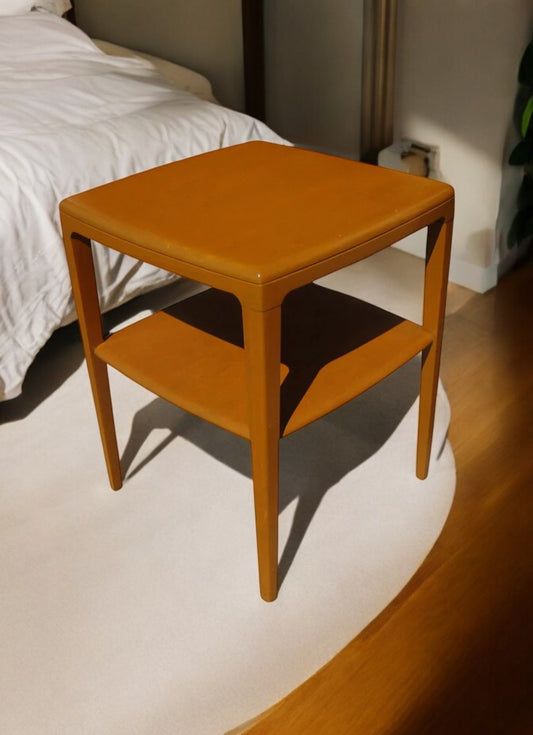 Vintage Heywood Wakefield wooden side table with mid century design.