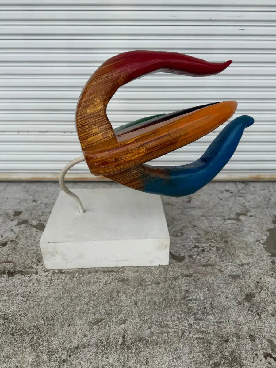 carved wooden floral sculpture with organic curved design