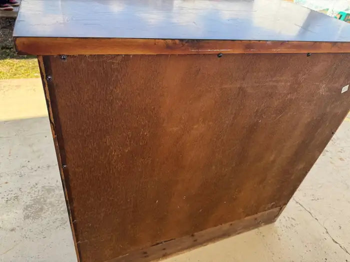 Traditional bedroom nightstand with rich wood grain
