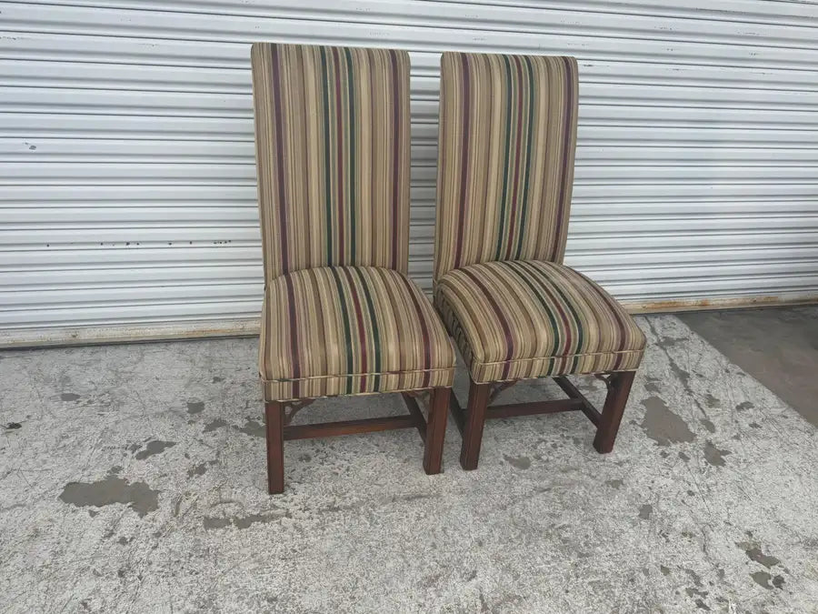Antique mahogany dining chairs with intricate woodwork