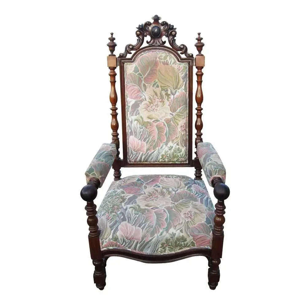 Antique high back armchair elaborate crest details