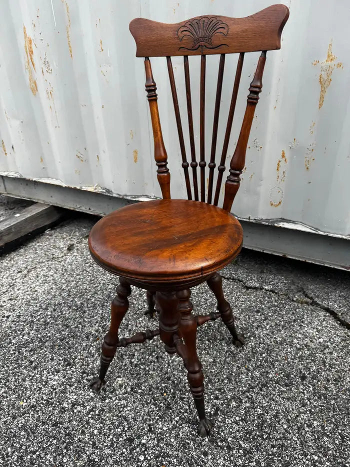 Antique marble top piano chair with ornate spindle back design