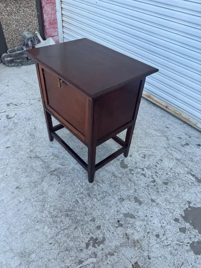 Antique smoking stand with hinged drop-front door