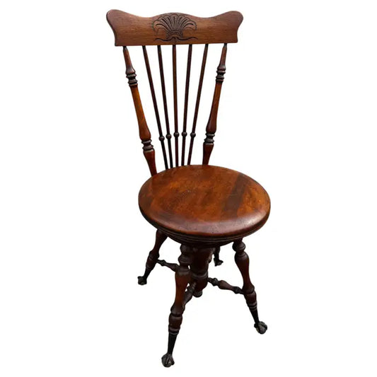 Antique Victorian walnut swivel piano stool with marble top and carved ball and claw feet