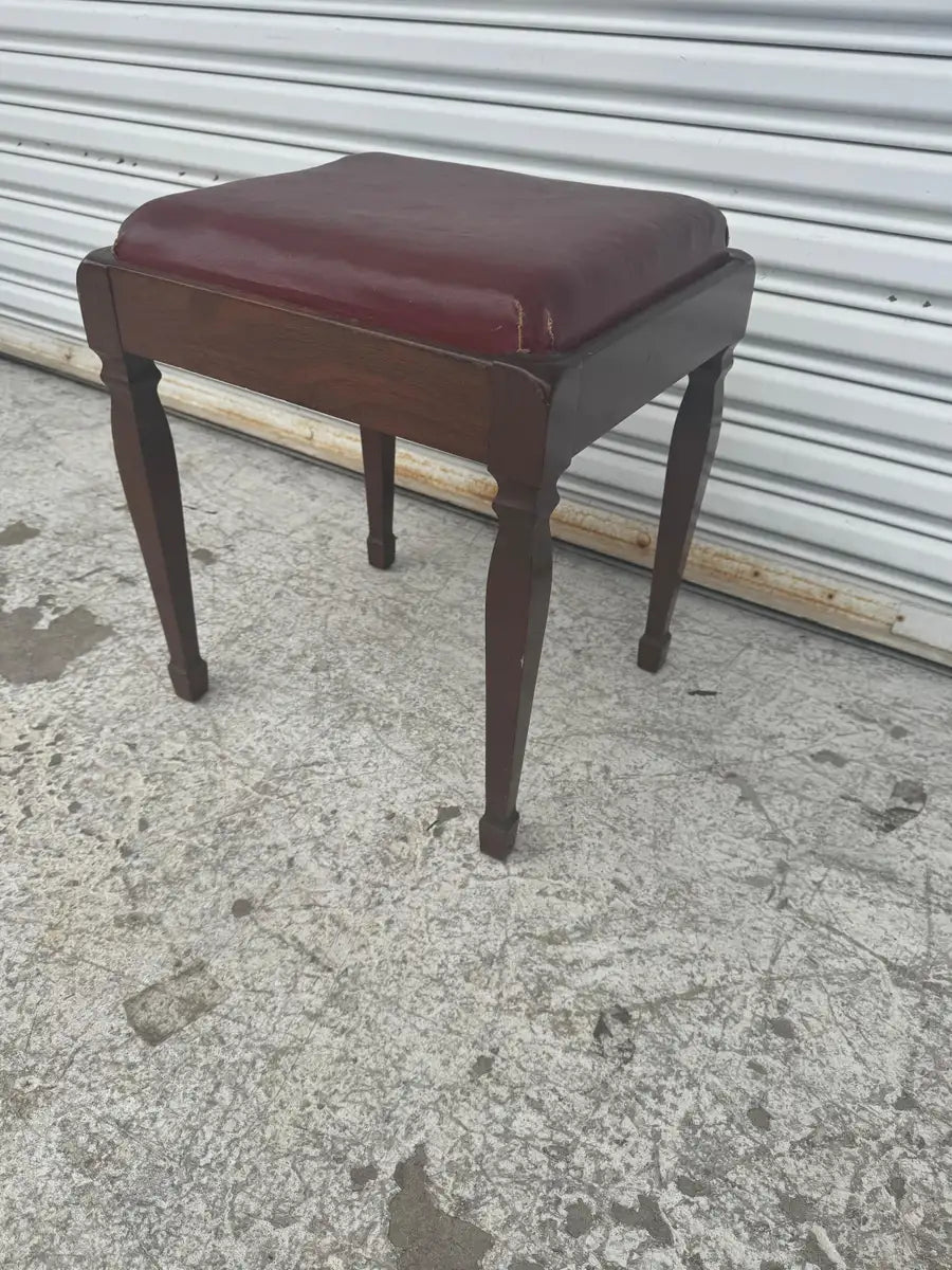 Antique wooden stool with hinged seat and storage space