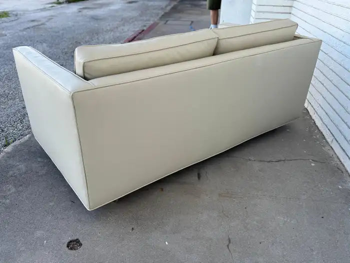 Restored modernist loveseat with plush seating