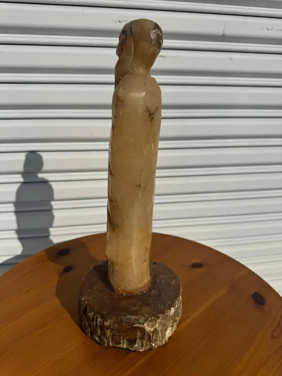 Natural stone monk statue with detailed carving