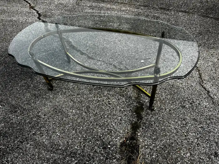 Beveled glass coffee table on marble floor