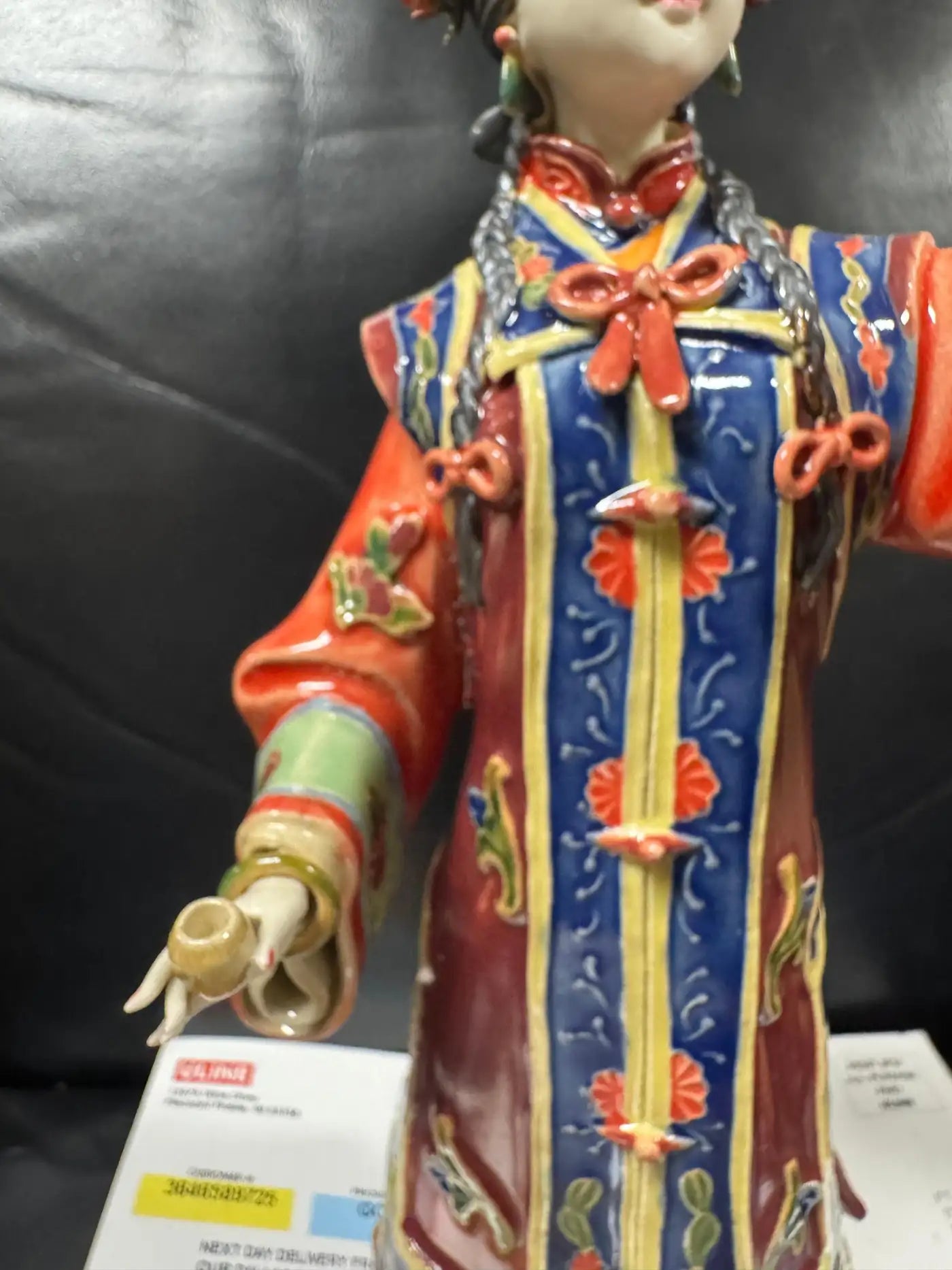 Red and blue floral enameled Geisha girl ceramic figurine