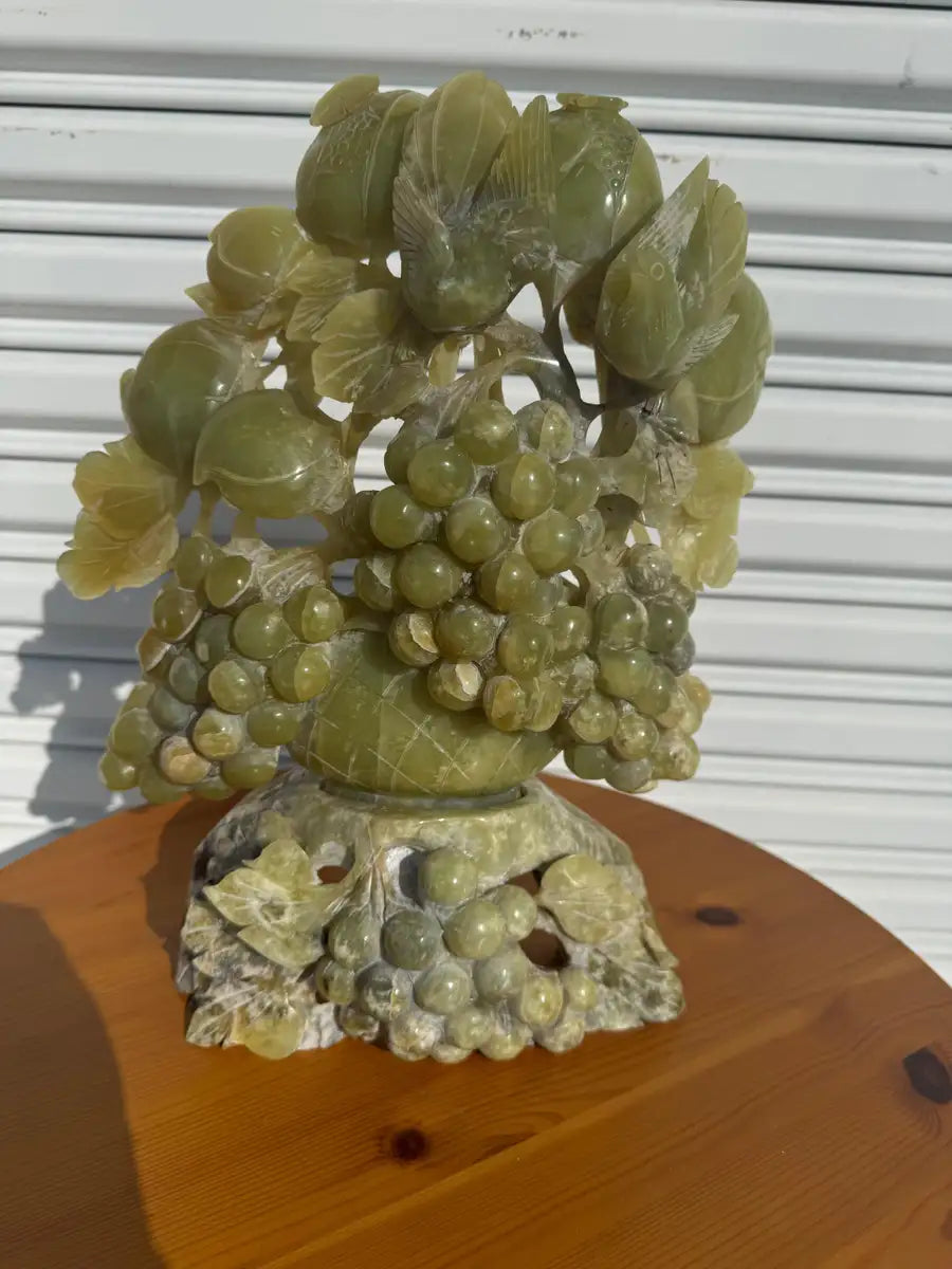 Handcrafted jade grapes sculpture with intricate bird details