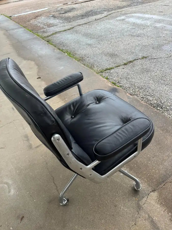 Black leather swivel office chair for executive workspace