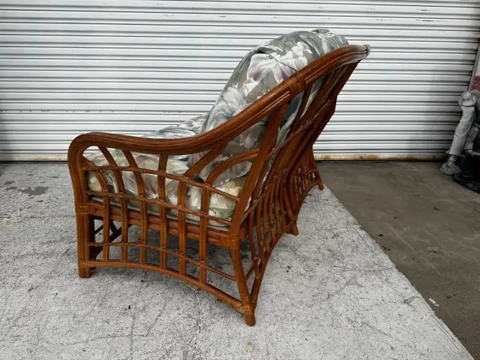 Boho style loveseat crafted from woven rattan