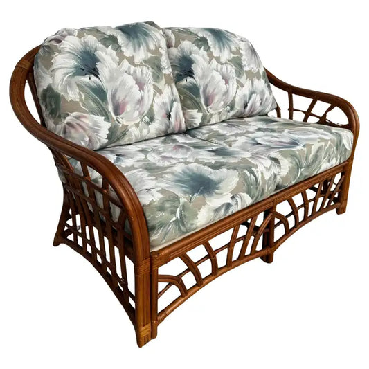 Boho chic rattan loveseat with upholstered cushions