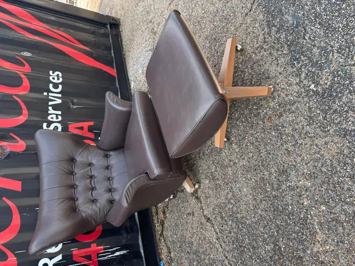 Contemporary brown leather lounge chair and ottoman