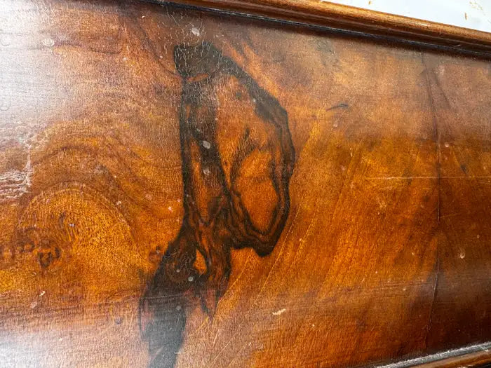 Antique twin sleigh bed with curved headboard