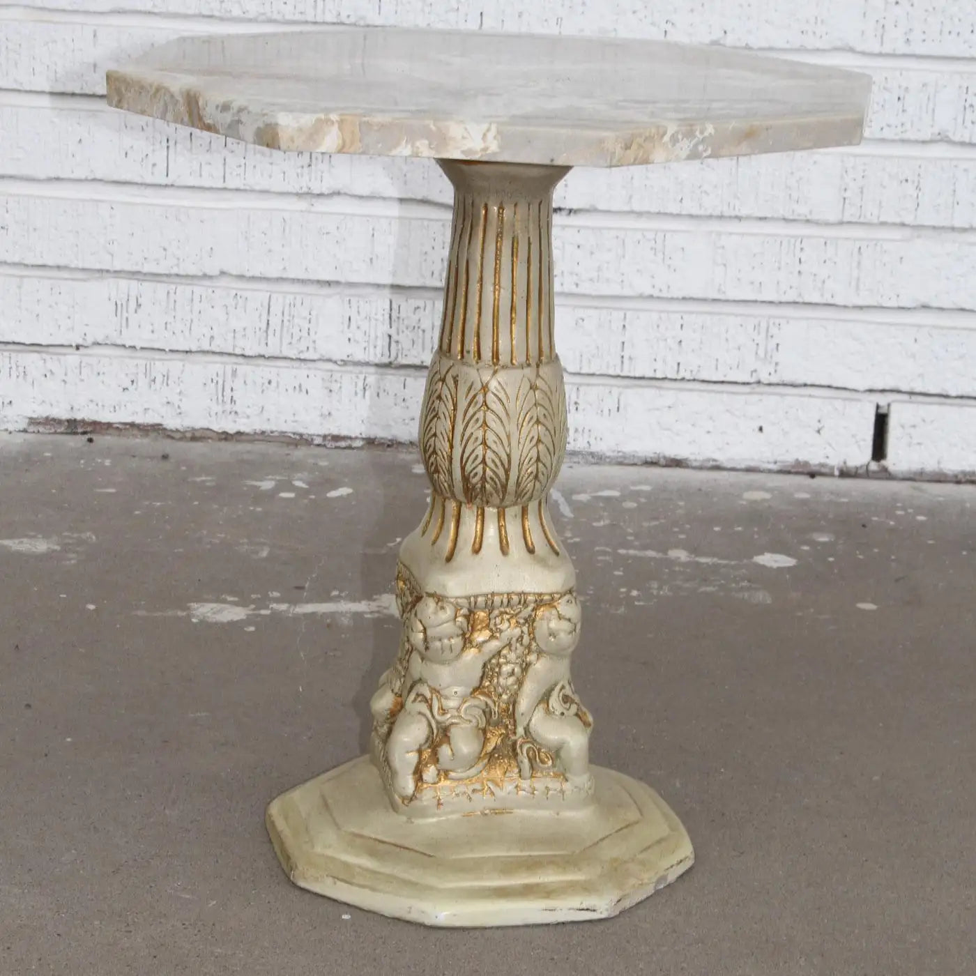 Luxury accent table with carved pedestal and marble top