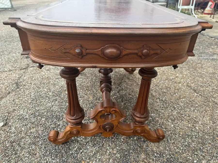 Classic walnut writing desk with leather inset top and drawers