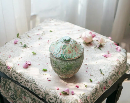 Chinese offering pot from the Yuan Dynasty on floral table