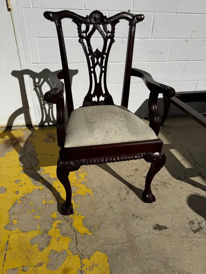 Antique mahogany armchair with carved claw feet