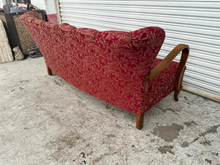 designer bentwood sofa with rounded arms and upholstery