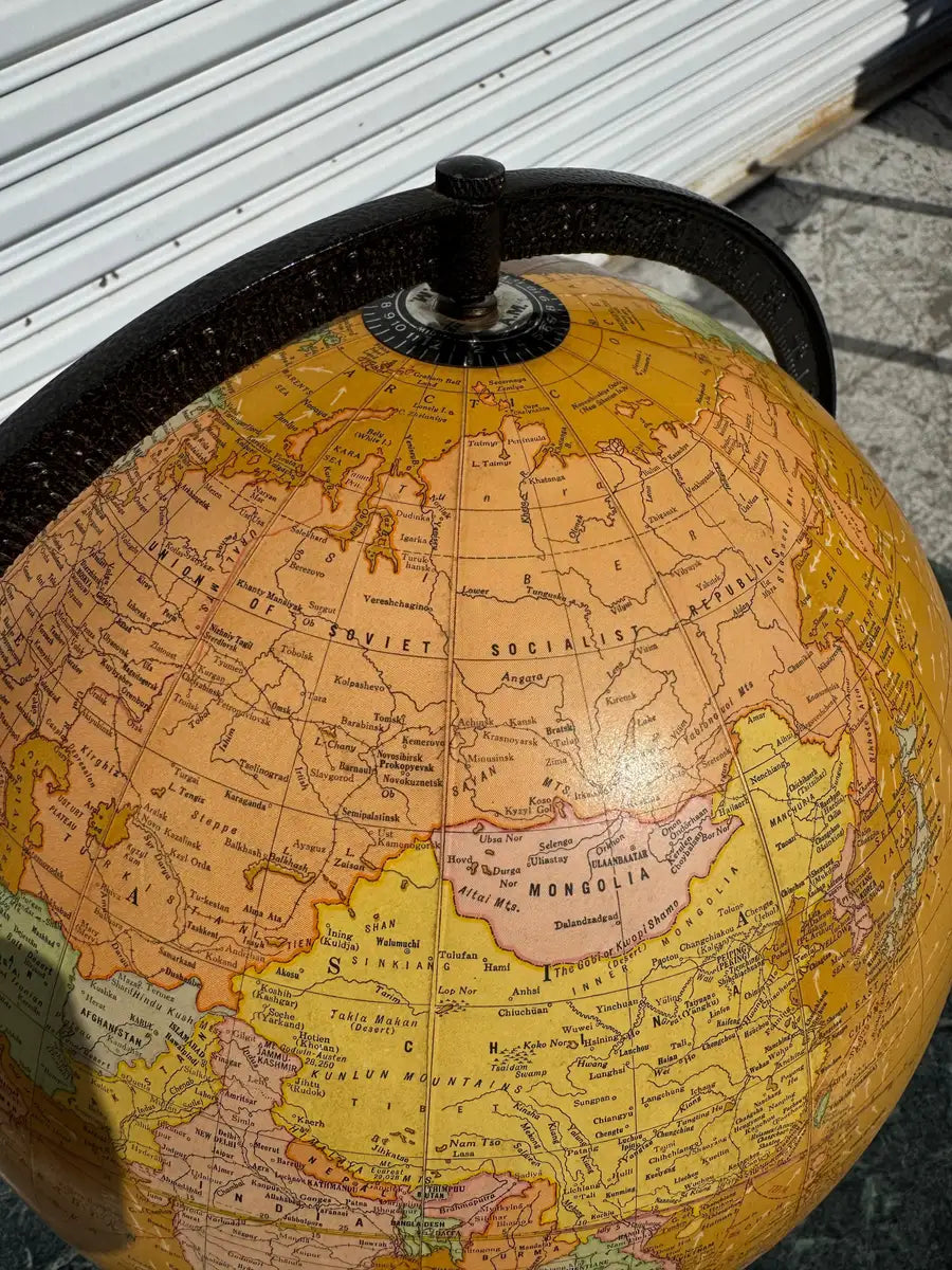 decorative globe with warm light and wood stand