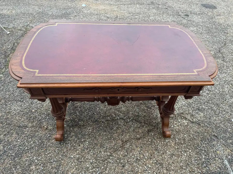 Solid wood executive desk with elegant leather writing area