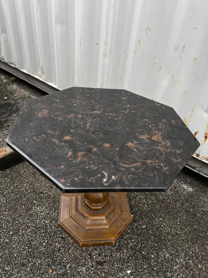 Classic pedestal base table with polished granite surface