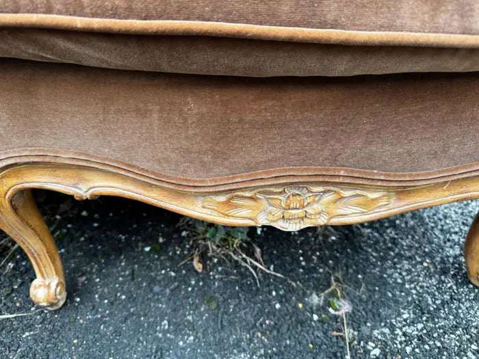 Vintage French sofa with cabriole legs and curved silhouette