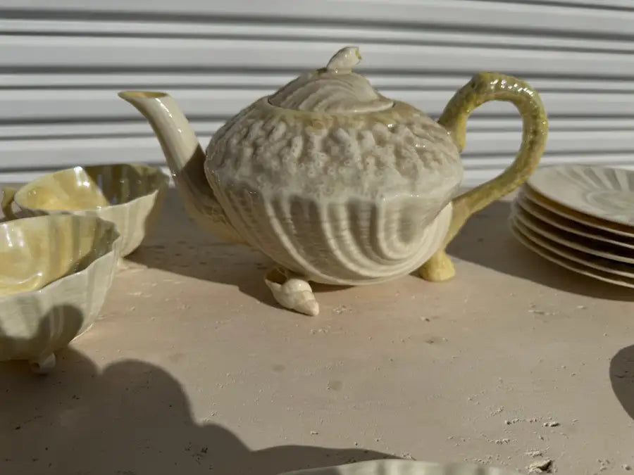 Vintage ceramic tea set with ocean inspired relief pattern