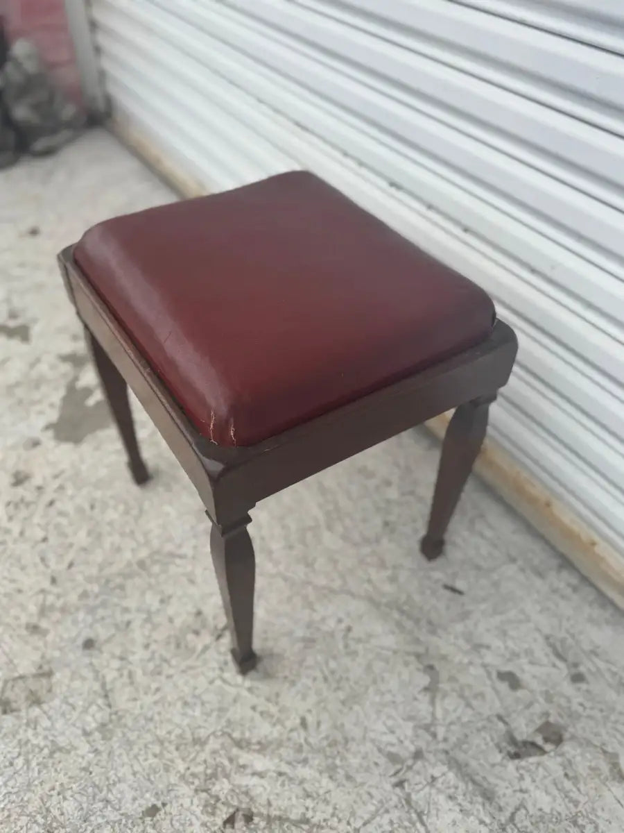 Vintage storage stool with rich walnut wood grain