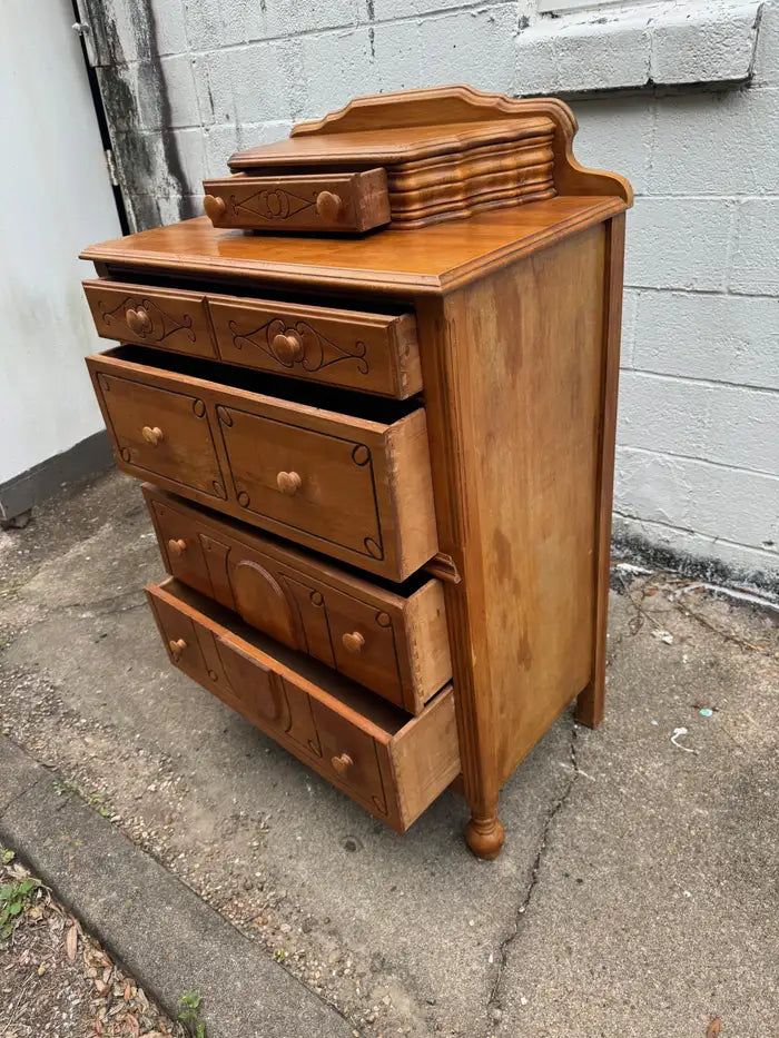 Rustic antique dresser with decorative drawer hardware
