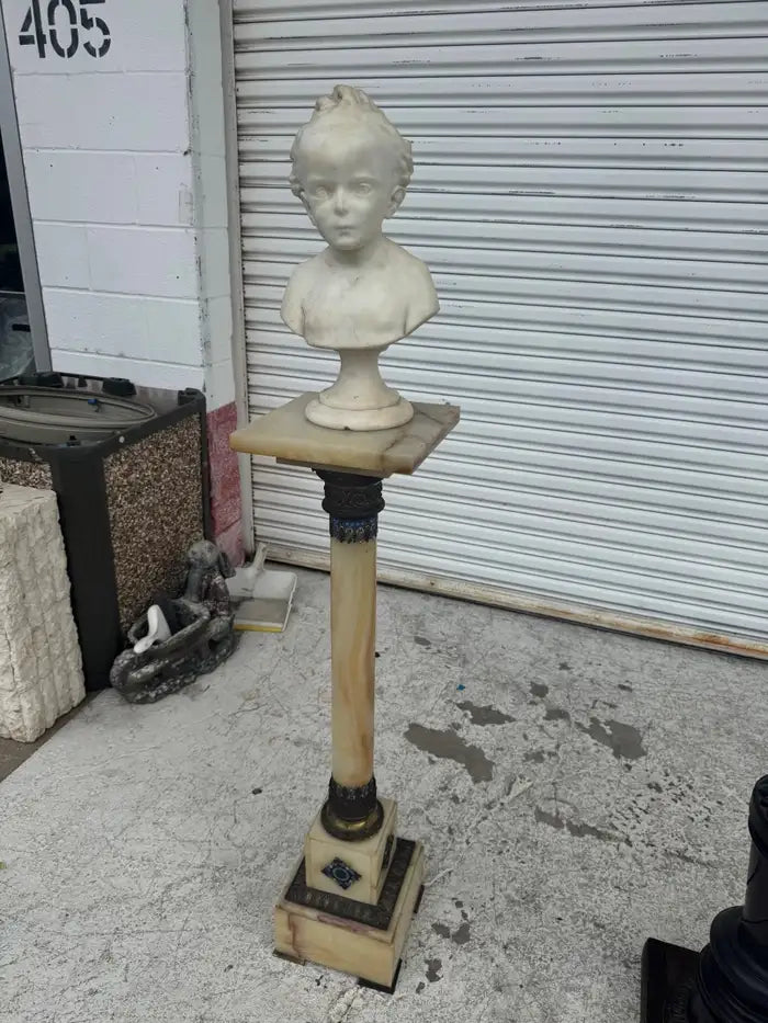 Antique figurative sculpture crafted from white marble