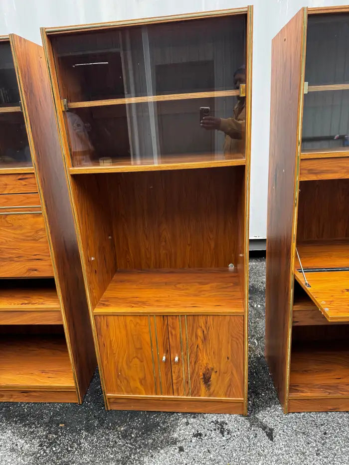 Walnut bookcase with glass shelves and lighting