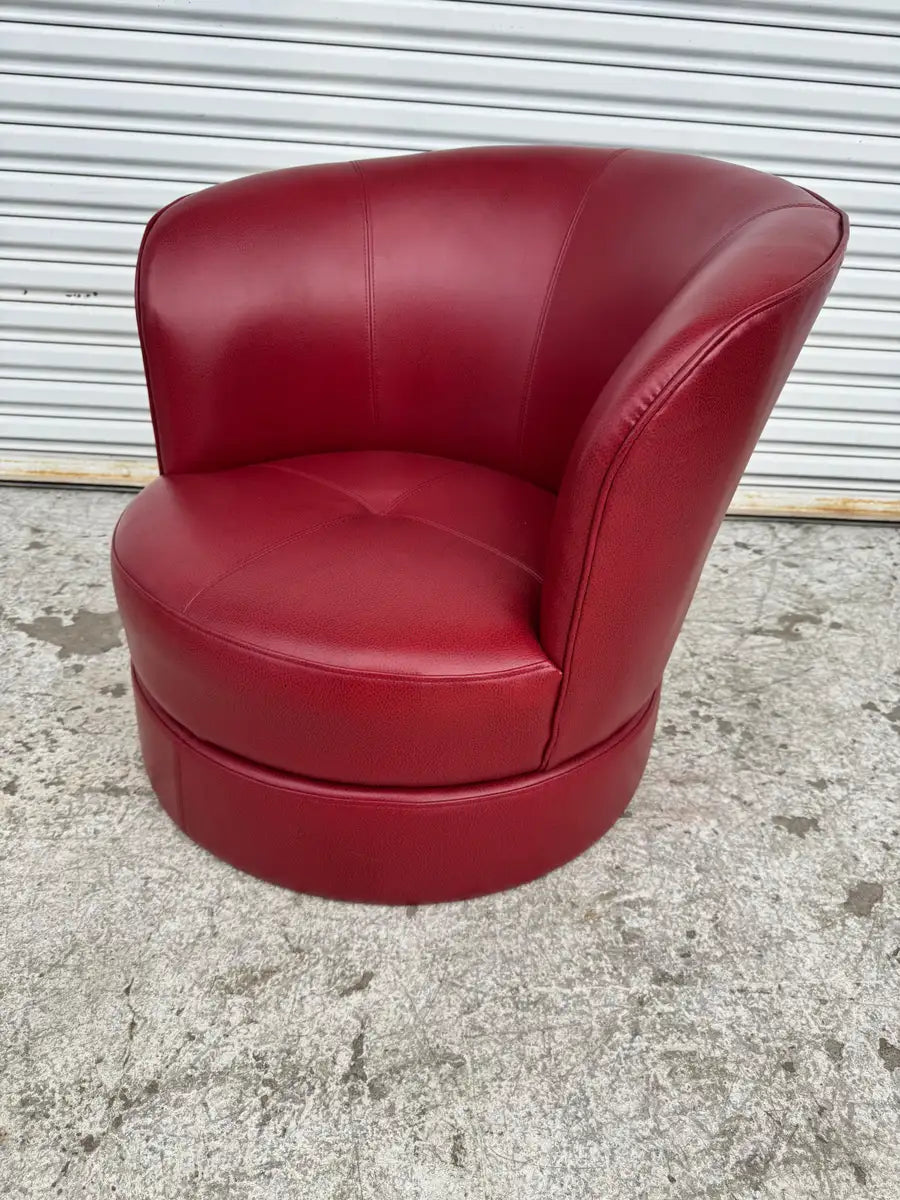 barrel back armchair with smooth leather and swivel base