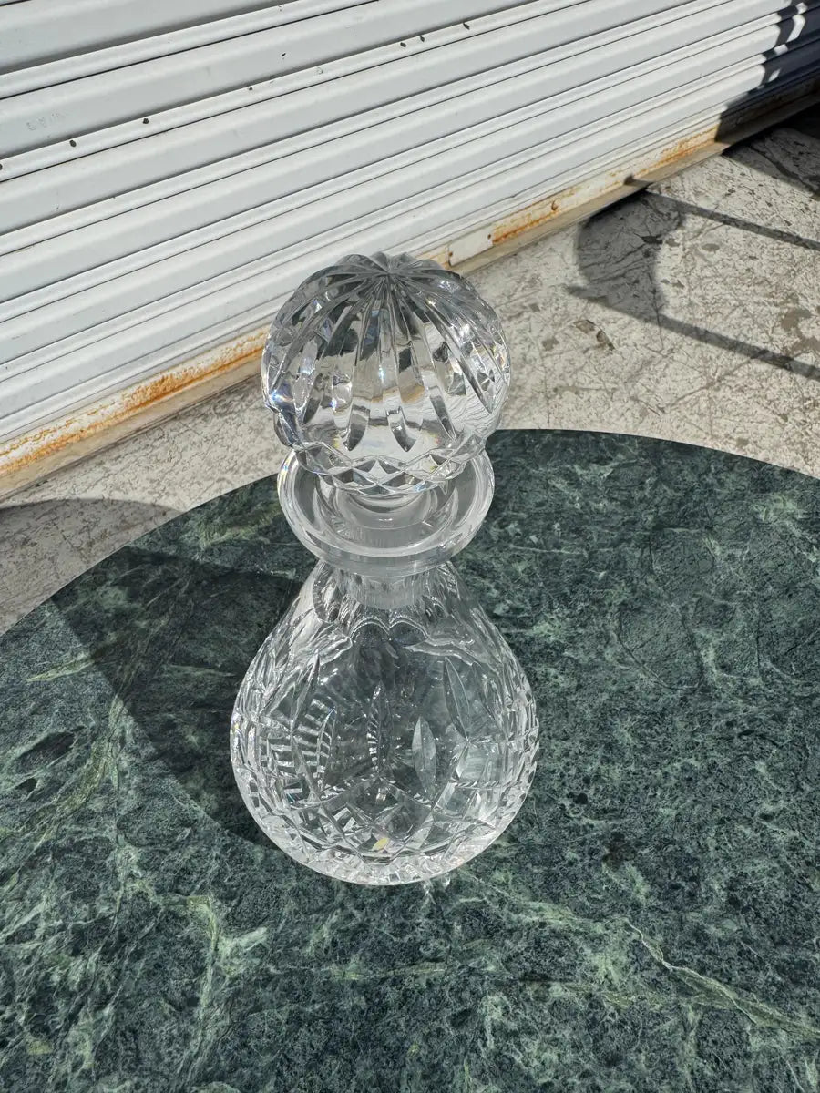 elegant glass decanter with faceted stopper top