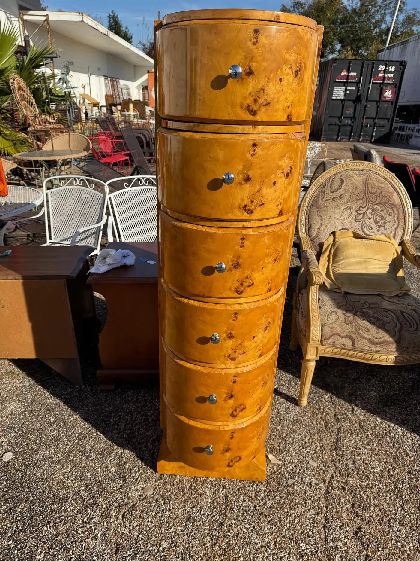 Vertical Art Deco chest of drawers in book-matched burl veneer for designer interiors.