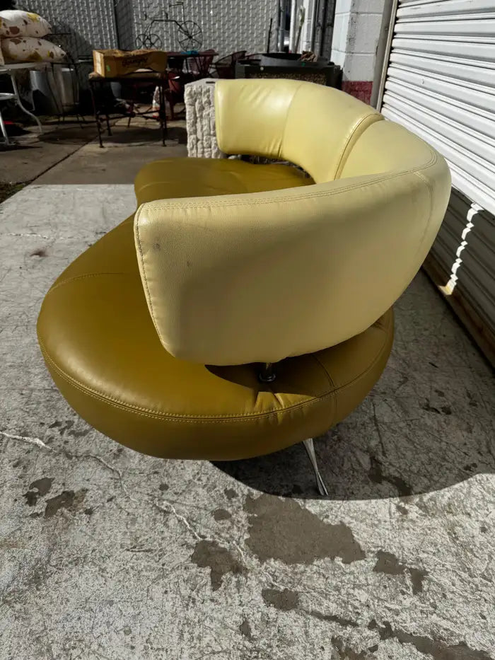 Curved leather sofa with smooth tailored upholstery