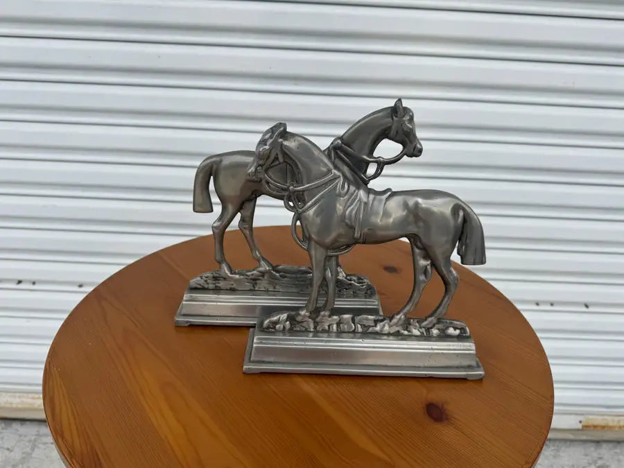 decorative pewter bookends featuring horse pair sculpture